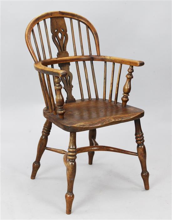 A 19th century yew and elm Windsor chair with crinoline stretcher, H. 3ft 2in.